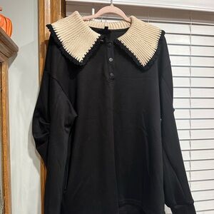 Chic Black Sweater with Cream Collar